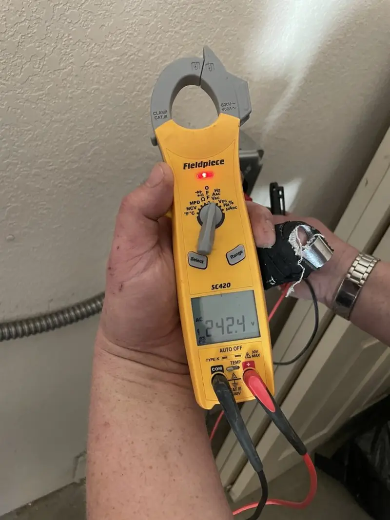 Voltage testing with clamp meter during Recessed Lighting Installation in Marlton